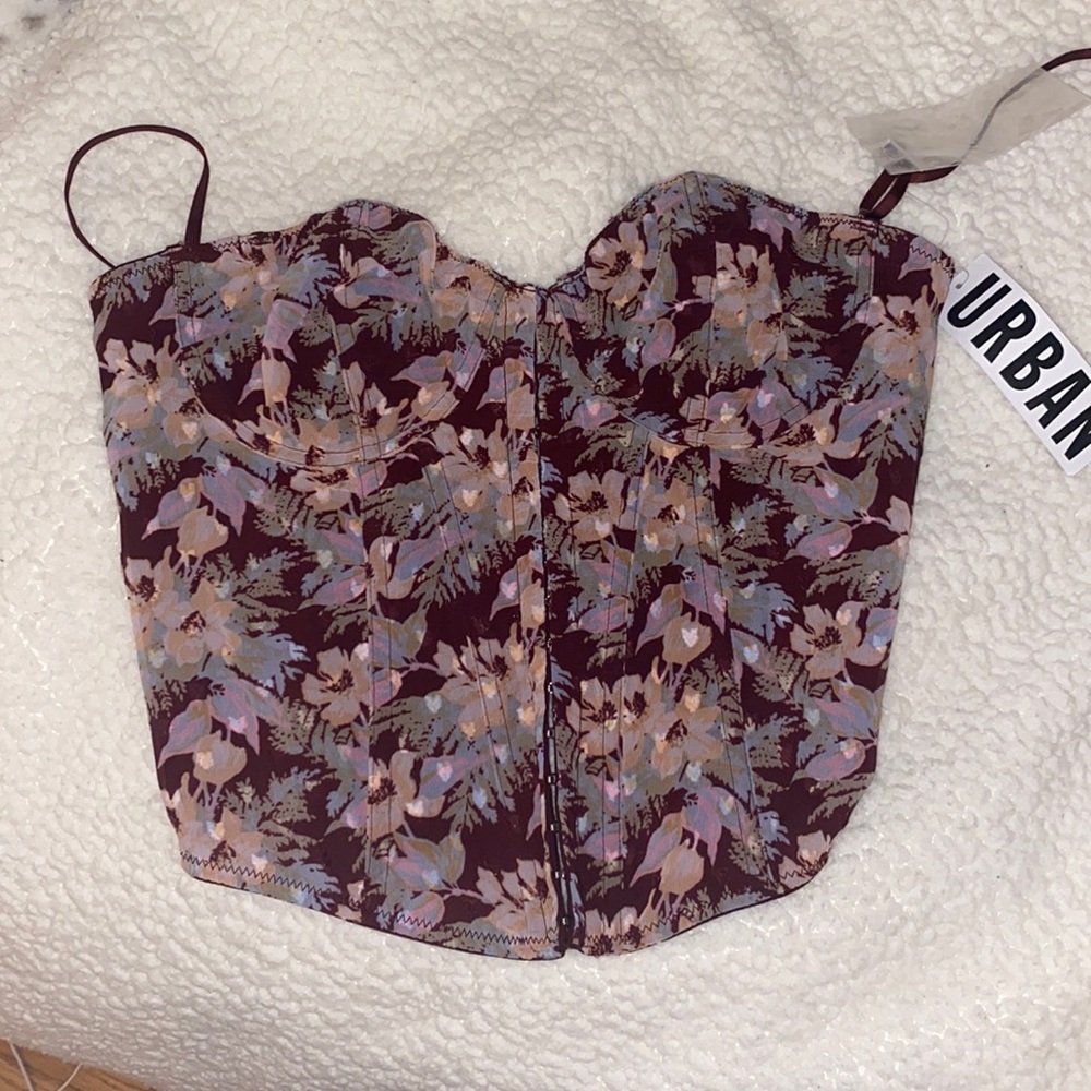 Never worn before urban top/corset.Size L but fits like a bigger medium!